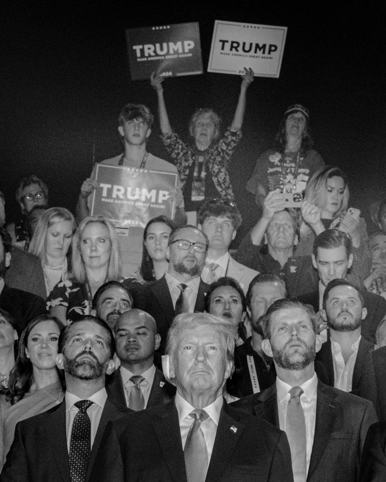 Former President Donald Trump is flanked by his sons, Donald Trump Jr. and Eric Trump, as well as party members and supporters on the first night of the Republican National Convention in Milwaukee, WI, July 15, 2024.